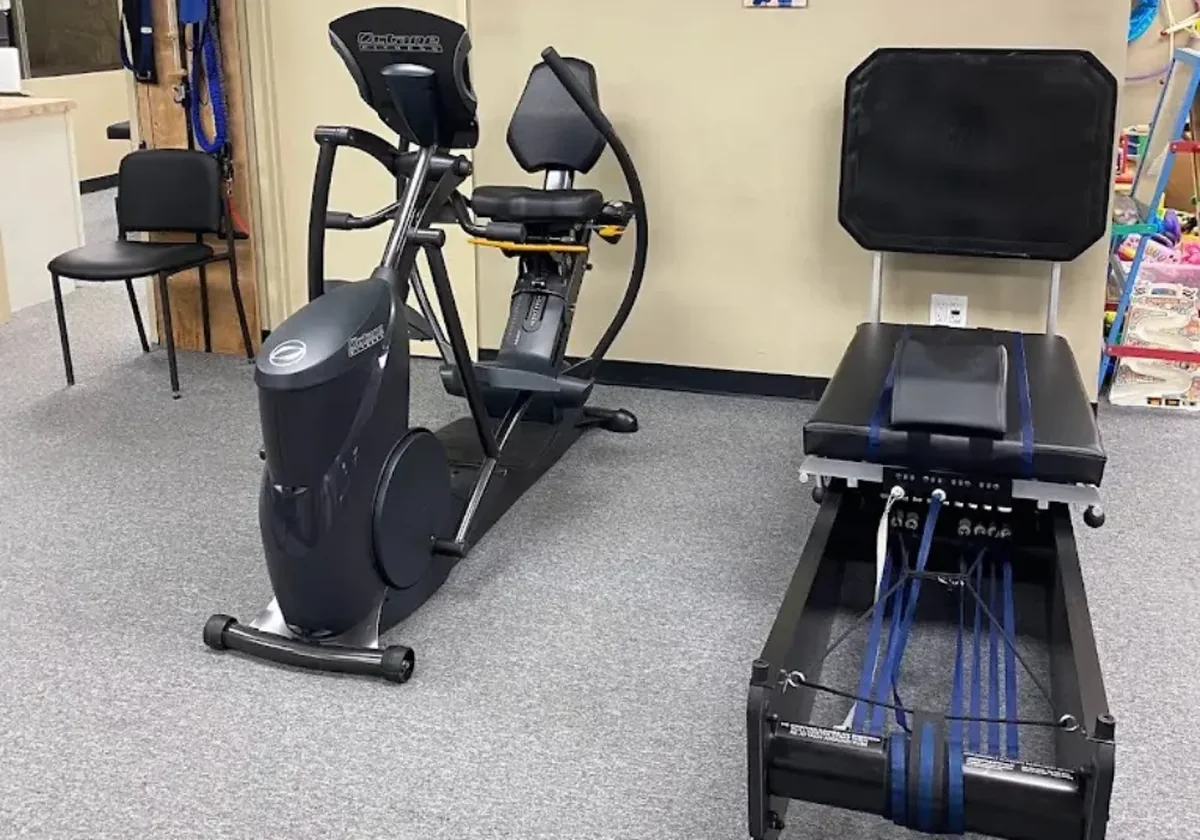 Equipment corner with a stationary bike and a treatment table