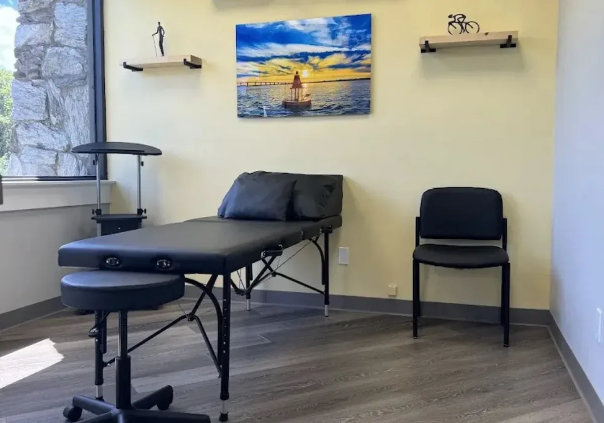 Private treatment room with ocean artwork on the wall