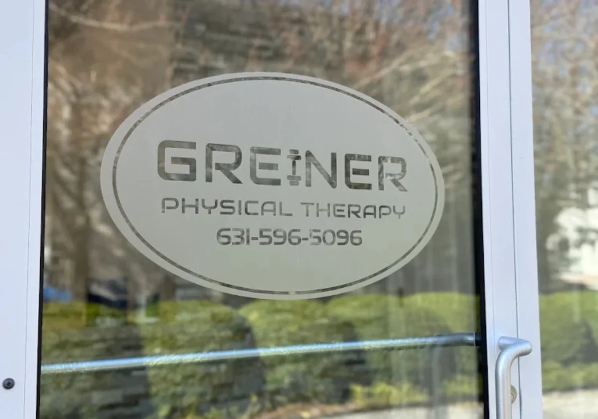 Window signage at the Quogue location